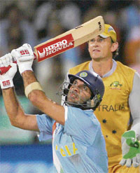 Yuvraj Singh hits a six as Gilchrist (right) looks on during the semifinal of the Twenty20 World Cup in Durban on Saturday.