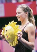 Russia�s Maria Kirilenko holds the tournament mascot after winning the Sunfeast Open tennis event in Kolkata on Sunday. She beat Ukraine�s Mariya Koryttseva 6-0, 6-2 in the final.