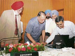Punjab Governor Gen S.F.Rodrigues (retd) launches a website on the Encyclopaedia of Sikhism at Punjab Raj Bhavan in Chandigarh on Monday. On left is vice-chancellor of Punjabi University S.S.Boparai