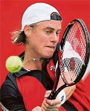 Australia�s Lleyton Hewitt plays a return to Ti Chen of Chinese Taipei during the first round of the Mumbai Open tennis tournament on Thursday.