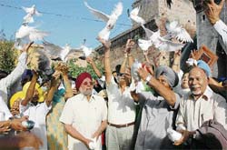 Pigeons being released by residents of Narli village on Saturday to mark the birth centenary celebrations of Shaheed Bhagat Singh