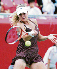 Maria Kirilenko returns a shot to Eleni Danilidou during their semifinal match of the Hansol Korea Open. 