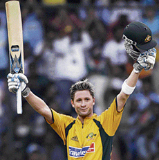 Australian cricketer Michael Clarke celebrates his century (130) during the first one-day international against India at the Chinnaswamy Stadium in Bangalore on Saturday.