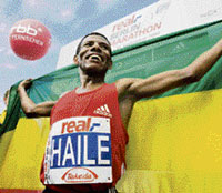 Haile Gebrselassie poses after setting up new world record at the 34th Berlin marathon in Berlin.
