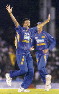 Sri Lankan seamer Farveez Maharoof celebrates the dismissal of England cricketer Kevin Pietersen during the first one-day match in Dambulla. 