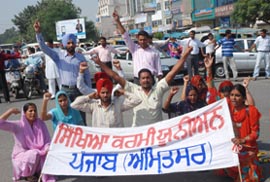 Members of the Education Volunteer Teachers� Union protest in Jalandhar on Tuesday.