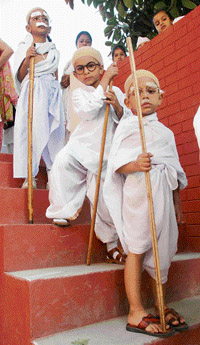 Children dress up as Mahatma Gandhi on the occasion of Gandhi Jayanti in Patiala