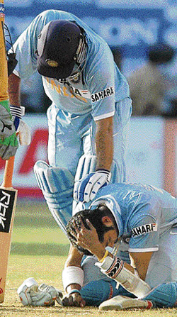 Indian captain M S Dhoni comforts Sreesanth after a shot by him hit on the latter�s helmet during the second ODI against Australia at Kochi on Tuesday.