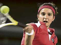 Sania Mirza of India returns a shot to Flavia Pennetta of Italy during her quarterfinal match at the Japan Open tennis tournament in Tokyo on Thursday.
