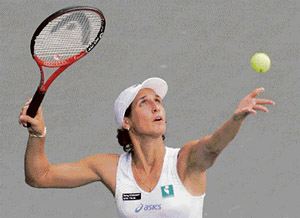 Virginie Razzano serves to Venus Williams at the finals of the Japan Open tennis tournament in Tokyo on Saturday.
