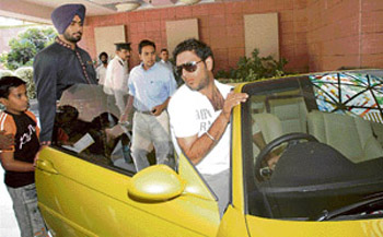 Star cricketer Yuvraj Singh arrives at Hotel Taj, Chandigarh, in his yellow BMW sports car along with other members of the Indian team on Saturday for the fourth one-day match between India and Australia of the Futures Cup series to be played at the Sector 16 cricket stadium on October 8