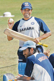 Mahendra Singh Dhoni and Sachin Tendulkar during the practice session at the Sector-16 cricket stadium in Chandigarh on Sunday.