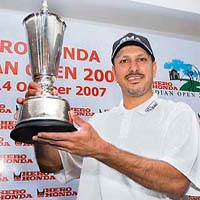 Jeev Milkha Singh poses with the trophy of the Indian Open in New Delhi
