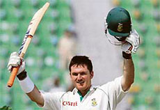South Africa�s Graeme Smith acknowledges the crowd after completing his century on the fourth day of the second Test against Pakistan in Lahore on Thursday.