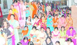 Women chant hymns to mark the first day of Navratras at Mata Launga Devi Temple in Amritsar