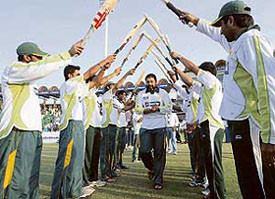 Pakistan players present a guard of honour for Inzamam-ul-Haq on the final day of the second Test against South Africa in Lahore on Friday.