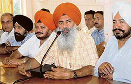 All-India Motor Transport Congress President Charan Singh Lohara makes a point at a press conference in Jalandhar on Friday.