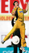 Australia�s Brad Hogg celebrates after dismissing Yuvraj Singh.