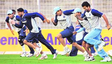 Indian players sprint during a cricket training session in Mumbai on Tuesday. India will play their seventh and final one-day international match against Australia on Wednesday