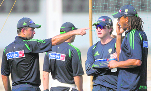 Australia captain Ricky Ponting (L) talks with team mates Brad Hodge and Andrew Symonds (R) during a cricket training session in Mumbai on Tuesday