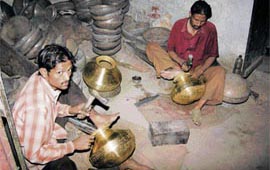 Brass utensil makers at their workshop in Rewari. 