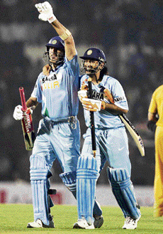 Yuvraj Singh (left) and Mahendra Singh Dhoni acknowledge the crowd after India beat Australia in the Twenty20 match at the Brabourne Stadium in Mumbai on Saturday