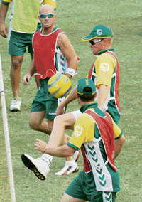 South Africa�s Herschelle Gibbs and Shaun Pollock (right) play football during a practice session at the Iqbal Stadium in Faisalabad on Monday.