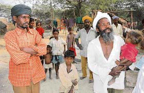 Families of migrant labourers who have allegedly encroached upon forest land at Jathaul village