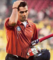 India Red batsman S. Badrinath returns to the pavilion after the completion of the innings against India Green during the Challenger Trophy in Ahmedabad on Friday.