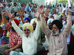 Workers of thermal plant taking out a gate rally in Bathinda on Tuesday.