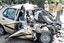 The mangled remains of the Tata Indica car lies at the accident site near Khanpur village on Kurali road