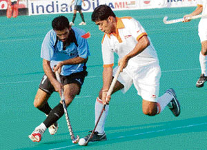 RCF and Indian Airlines players engaged in a tussle to collect the ball during the 24th Indian Oil Surjit Hockey Tournament in Jalandhar on Tuesday.