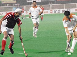 The match between the PSEB and Indian Airlines in progress at the 24th Indian Oil Surjit Hockey Tournament in Jalandhar on Wednesday.