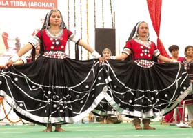 Students compete in a dance contest at the festival in Abohar