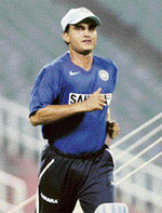 Former captain Sourav Ganguly jogs around the Eden Garden Stadium during a practice session in Kolkata