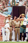 Pakistani cricketer Shoaib Akhtar wears the cap of a Delhi policeman during a practice match against Delhi�s Ranji Trophy team, at Ferozshah Kotla stadium in New Delhi on Friday.