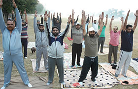 Policemen doing exercise, to compete in a weight losing contest, at the parade ground, Police Lines, on Sunday morning.