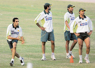 Pakistani cricketer Umar Gul (L) prepares to catch a ball during a training session on the eve of the first one-day international match in Guwahati on Sunday.