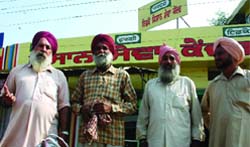 Farmers returning empty handed from IFFCO office in Grain Market, Bathinda, on Monday.