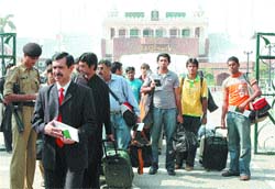 Players of the hockey team of the Multan Racket Club cross over to India at the Attari Wagah joint checkpost in Amritsar for participating in the 37th S.N Vohra Gurmeet Memorial Hockey Championship being organised in Chandigargh.