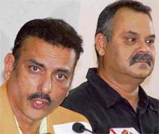 Ravi Shastri (L), chairman, National Cricket Academy, with Dav Whatmore, director, operations, NCA, at the PCA Stadium in Mohali on Tuesday.