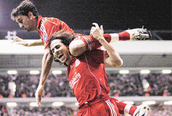 Liverpool�s Yossi Benayoun (right) celebrates with team-mate Alvaro Arbeloa after recording a hat-trick against Besiktas during their Champions League soccer match at Anfield