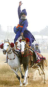 A Nihang displays his martial arts skill on the occasion of Bandi Chhor Divas in Amritsar on Saturday.