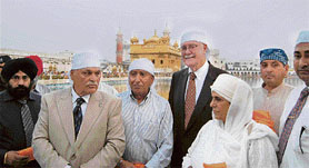 Mayor of Bakersfield Harvey L.Hall (in black suit) after paying obeisance at the Golden Temple in Amritsar on Saturday.