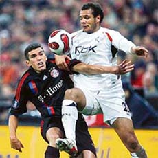 Bayern Munich�s defender Lucio (L) vies with Bolton Wanderers� forward Daniel Braaten during their UEFA group F match in Munich