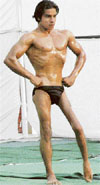 A participant afflicted with polio strikes a pose during the Mr Patiala Body Building Championship in Patiala