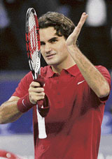 Roger Federer celebrates after beating Andy Roddick 6-4, 6-2 in their Masters Cup match in Shanghai on Friday.