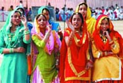 Students of Guru Nanak Dev Public School, Kamla Nehru Nagar, performing on annual sports day function on Tuesday. 