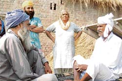 Ghulam Mohammad (right) with his childhood friend at Kaunke village which is only 8 km from his village in Pakistan.