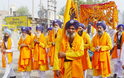 Devotees taking out a procession on the eve of the birth anniversary of Sri Guru Nanak Dev in Bathinda